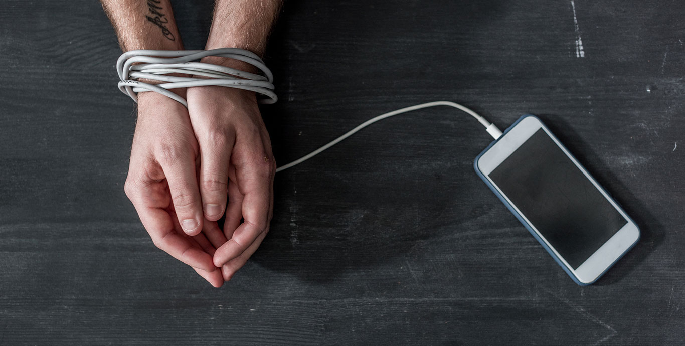 Hands tied together with the phone cable