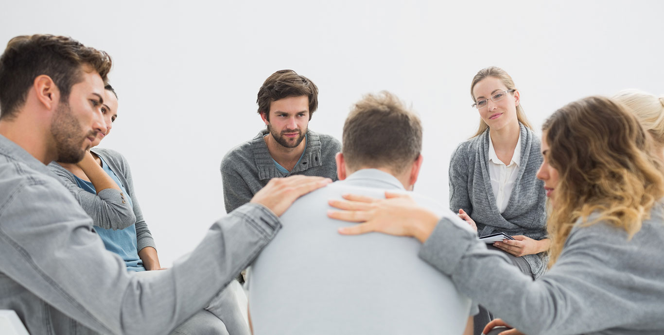 Group of people undergoing group therapy